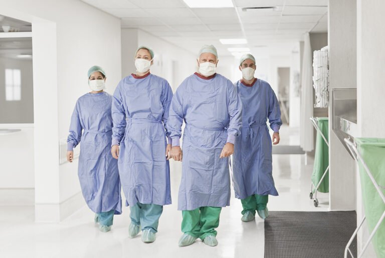 Surgical team walking in hospital